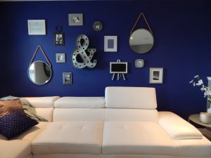 White sofa with blue wall